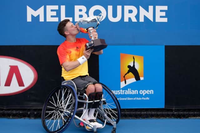 Reid kisses the trophy. Picture: Darrian Traynor/Getty