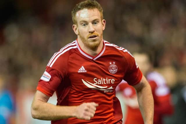 Adam Rooneys scoring record has been one of the keys to Aberdeens recent run of good form. Picture: SNS