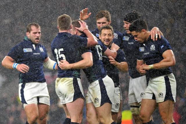 Mark Bennett celebrates the try that seemed to have put Scotland into a World Cup semi-final, only for the voracious jaws of fate to swallow a nation's hopes. Picture: Jane Barlow