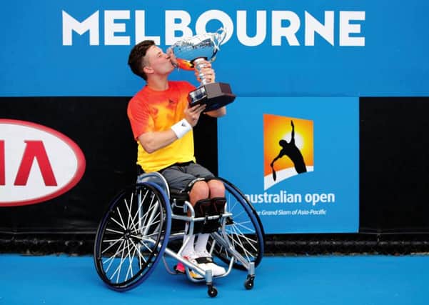Gordon Reid kisses the championship trophy after beating Belgium&#39s Joachim Gerard.  Picture: Darrian Traynor/Getty