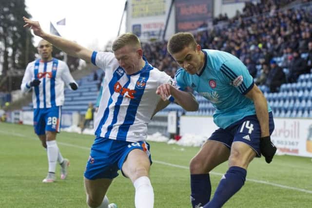 Hamilton goalscorer Carlton Morris, right, tries to fire in a cross at Rugby Park despite the attentions of Lee Ashcroft. Picture: SNS