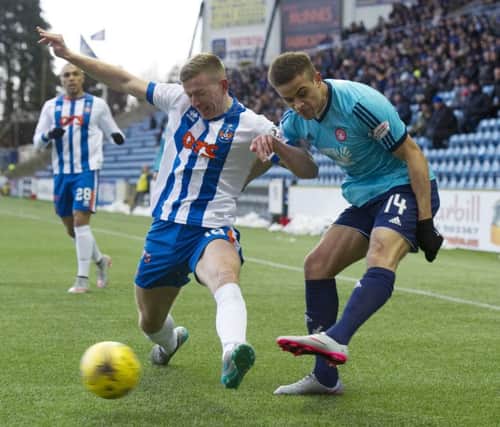 Hamilton goalscorer Carlton Morris, right, tries to fire in a cross at Rugby Park despite the attentions of Lee Ashcroft. Picture: SNS