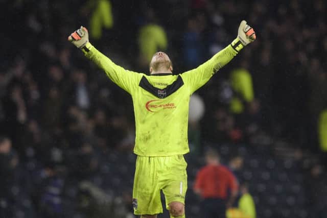 Ross County's Scott Fox celebrates at full-time. Picture: SNS
