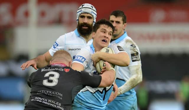 Glasgow Warriors' Sam Johnson is tackled by Ospreys' Dimitri Arhip
. Picture: Ian Cook/CameraSport