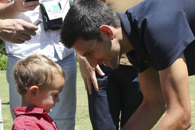 Novak Djokovic meets two-year-old Novak Jancovic, who was named after the tennis superstar. Picture: AP