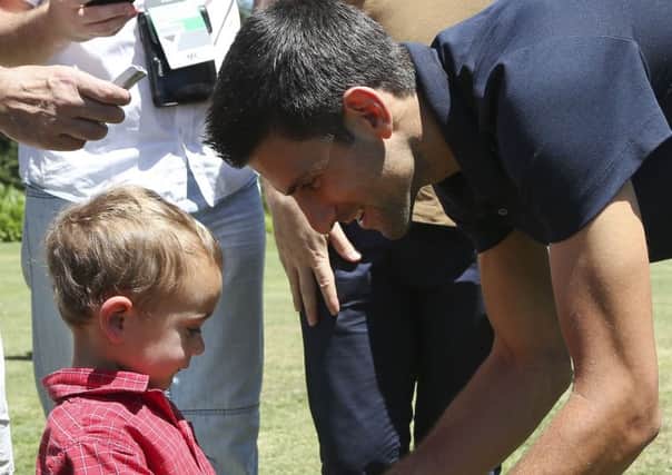 Novak Djokovic meets two-year-old Novak Jancovic, who was named after the tennis superstar. Picture: AP