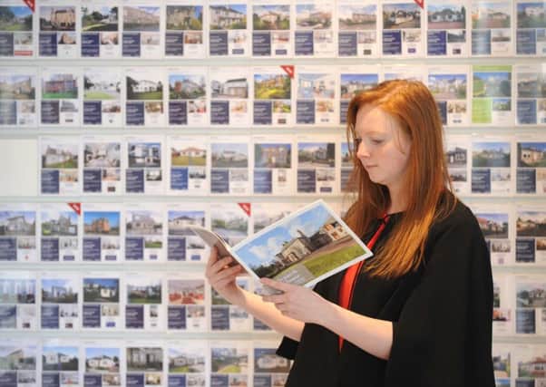 A potential buyer peruses schedules in Edinburghs ESPC shop. Picture: Jane Barlow