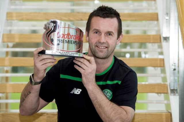 Celtic manager Ronny Deila is presented with the Ladbrokes Premiership Manager of the Month award for January. Picture: SNS