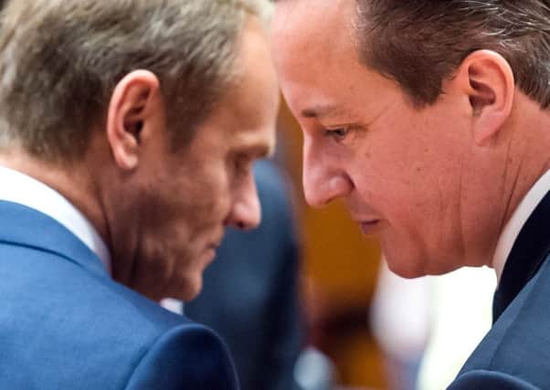 European Council President Donald Tusk, left, speaks withDavid Cameron during an EU summit in Brussels. Picture: AP