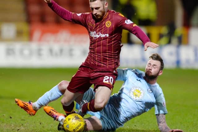 Motherwell's Louis Moult (left) battles for the ball against Christie Elliot. Picture: SNS Group