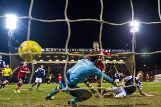 Rangers' Andy Halliday (centre) makes it 1-0. Picture: SNS Group