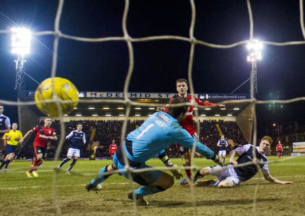 Rangers' Andy Halliday (centre) makes it 1-0. Picture: SNS Group