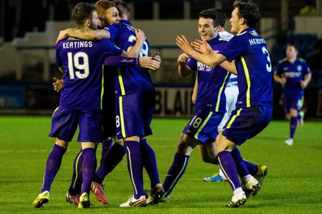 Hibernian's Anthony Stokes (centre blocked) celebrates having opened the scoring for his side. Picture: SNS Group