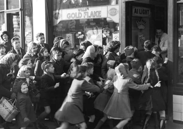 On this day in 1953, there were crowds of children queuing up outside sweetie shops as sugar rationing ended. Picture: Getty