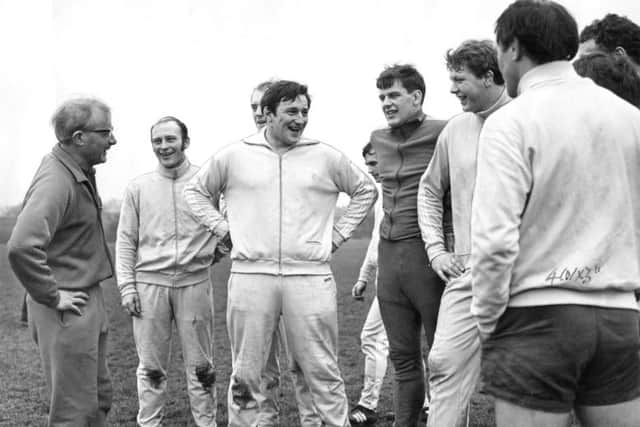 Bill Dickinson, left, adviser to the captain, leads a Scotland training session in the 1970s. He was replaced as coach in 1977 by Nairn MacEwan, second left here.