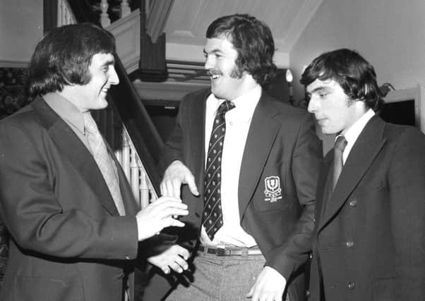 Scotland captain Ian McLauchlan greets new caps Alan Tomes and Ron Wilson to the team hotel as the Scotland squad gathers ahead of the match against England in February 1976.