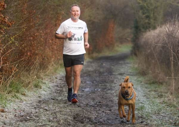 Ian Russell out training for his martahon with Kai. Picture: Peter Devlin/SSPCA