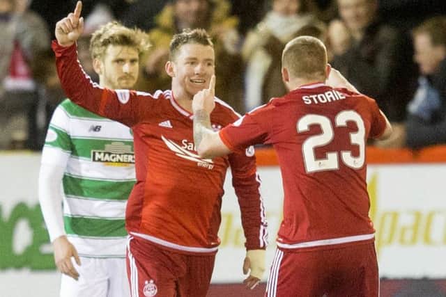 Jonny Hayes celebrates having put Aberdeen one goal to the good. Picture: PA