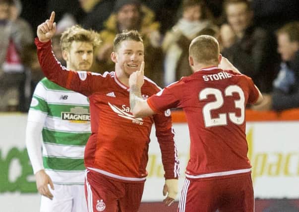 Jonny Hayes celebrates having put Aberdeen one goal to the good. Picture: PA