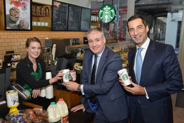 Nicola Riddell, store manager of Starbucks Canongate outlet, with rural affairs secretary Richard Lochhead (centre) and Graham's managing dierctor Robert Graham. Picture: Jon Savage