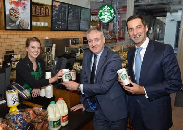 Nicola Riddell, store manager of Starbucks Canongate outlet, with rural affairs secretary Richard Lochhead (centre) and Graham's managing dierctor Robert Graham. Picture: Jon Savage