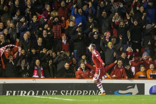 Aberdeen's Simon Church celebrates scoring his side's second goal of the game. Picture: PA