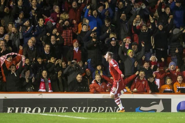 Aberdeen's Simon Church celebrates scoring his side's second goal of the game. Picture: PA