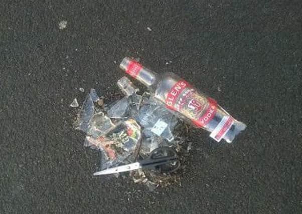 Picture: Smashed vodka bottle and discarded scissors