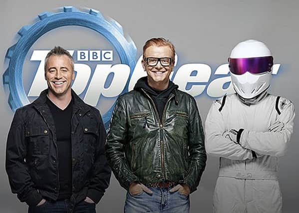 Friends actor Matt LeBlanc with Chris Evans and The Stig pose together as LeBlanc is announced as a co-presenter on the new series of Top Gear. Picture: PA