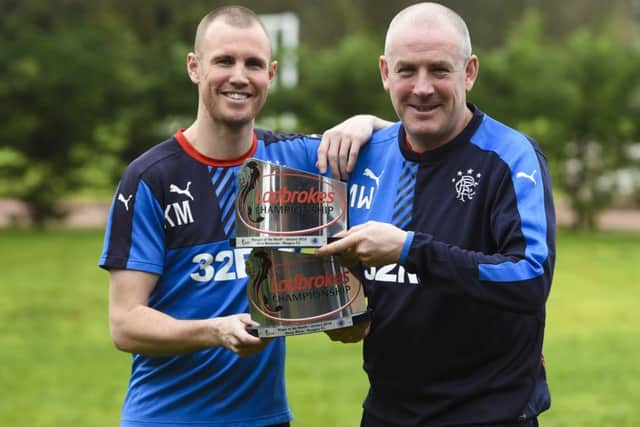 Rangers Manager Mark Warburton (right) joins Kenny Miller as they receive their awards. Picture: SNS