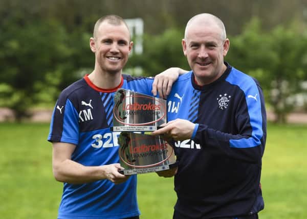 Rangers Manager Mark Warburton (right) joins Kenny Miller as they receive their awards. Picture: SNS