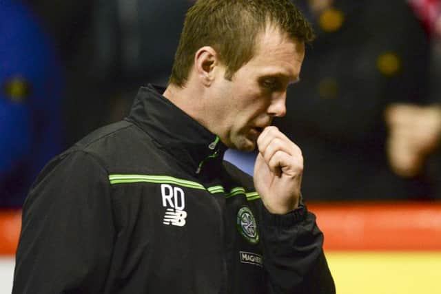 Celtic manager Ronny Deila cuts a dejected figure after his side's midweek league defeat at Pittodrie. Picture: Rob Casey/SNS Group.