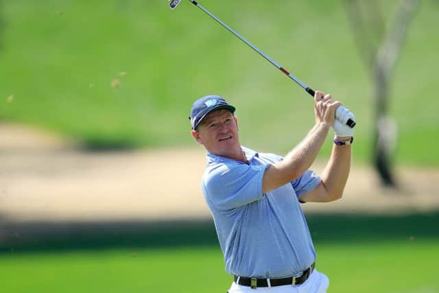 Ernie Els plays his second shot at the par-4 first hole in the first round of the Dubai Desert Classic. Picture: Getty