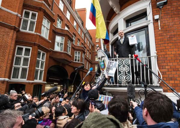 WikiLeaks founder Julian Assange addresses media and supporters from the balcony of Ecuador's embassy in central London. Picture: AFP/Getty Images
