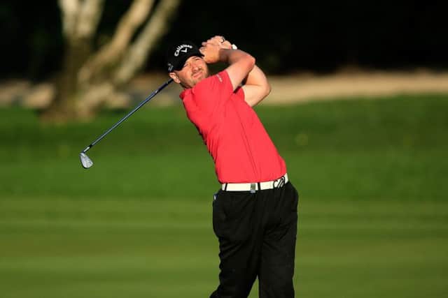 Craig Lee plays his second shot at the par 4, ninth hole on the Majlis Course at Emirates Golf Club. Picture: David Cannon/Getty