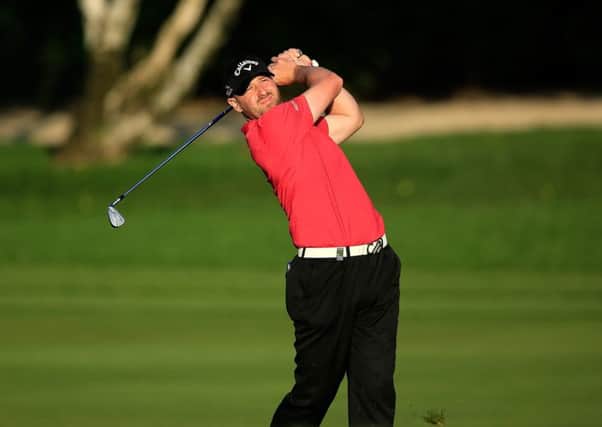 Craig Lee plays his second shot at the par 4, ninth hole on the Majlis Course at Emirates Golf Club. Picture: David Cannon/Getty