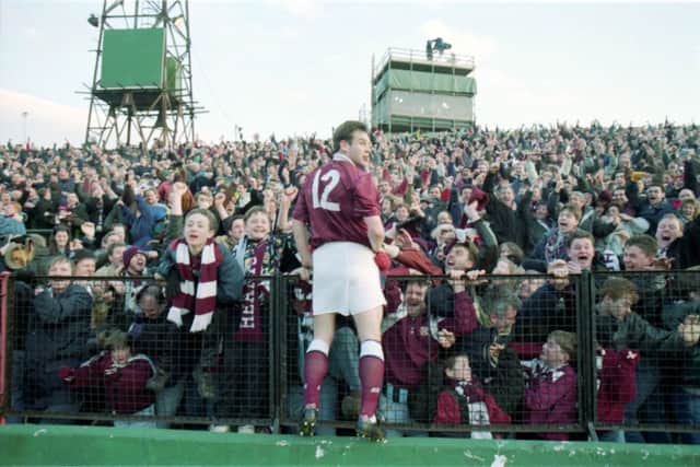 High point: Wayne Foster enjoys the adulation of fans after his last-minute winner at Easter Road in 1994. Photograph: Gordon Fraser