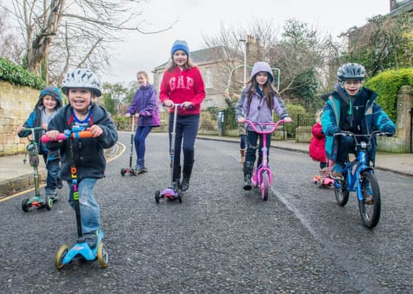 Children with Edinburgh Playing Out go play in the road. Picture: Ian Georgeson