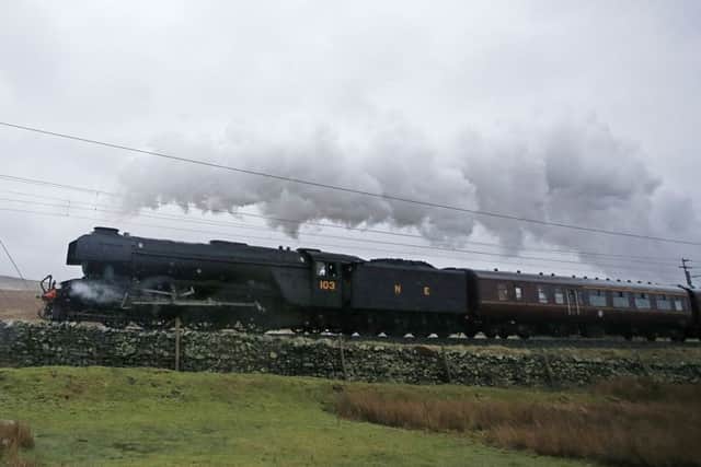 The Flying Scotsman heads north from Tebay in Cumbria yesterday as it hauls the Winter Cumbrian Mountain Express. Picture: Peter Byrne/PA Wire