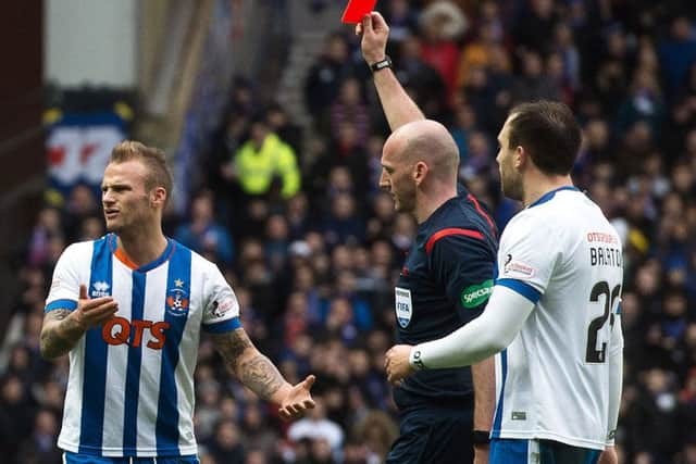 Kilmarnock's Kallum Higginbotham receives a straight red card for a rash challenge on James Tavernier of Rangers. Picture: Rob Casey/SNS