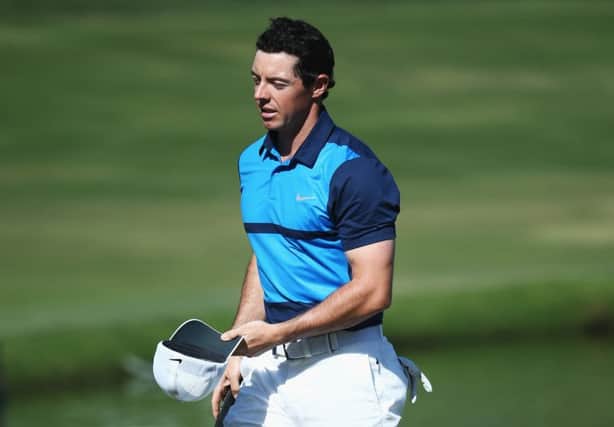 Rory McIlroy leaves the 18th green after shooting a 65 in the final round of the Dubai Desert Classic at the Emirates Golf Club. Picture: Warren Little/Getty Images