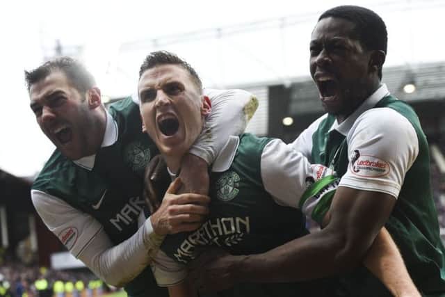 Hibernian's Paul Hanlon (centre) celebrates his goal with team-mates Kevin Thomson (left) and Marvin Bartley. Picture: SNS
