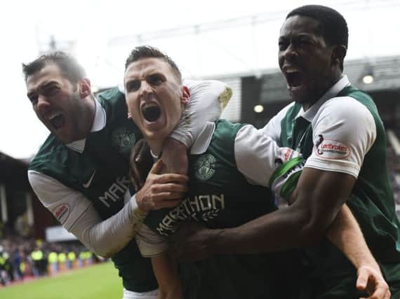 Hibernian's Paul Hanlon (centre) celebrates his goal with team-mates Kevin Thomson (left) and Marvin Bartley. Picture: SNS