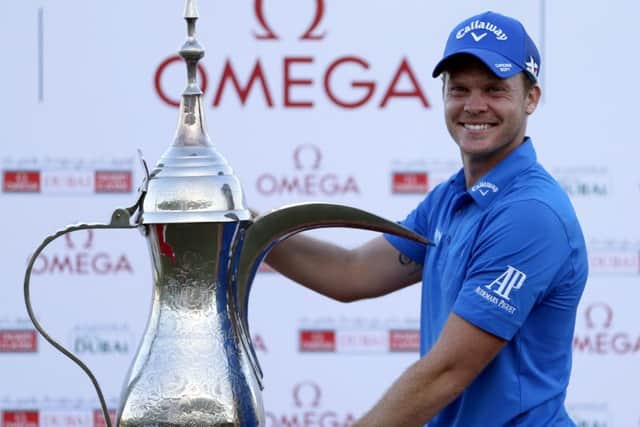Danny Willett with the trophy after his victory in the 2016 Dubai Desert Classic. Picture: Karim Sahib/AFP/Getty Images