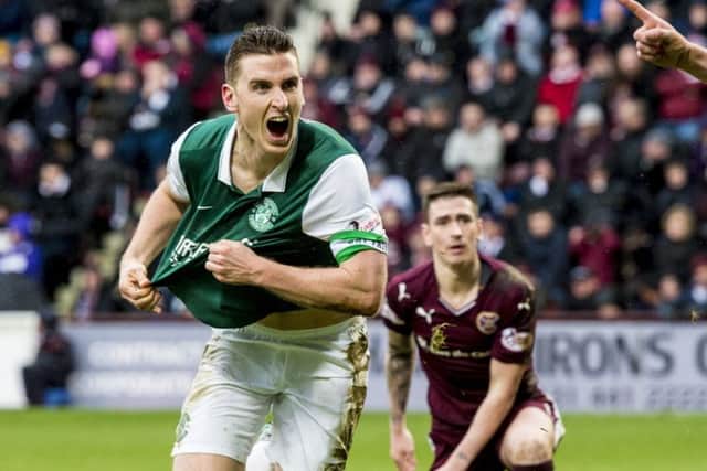 Paul Hanlon races away to celebrate his late equaliser in yesterdays Scottish Cup tie at Tynecastle. Picture: SNS