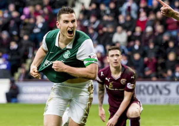 Paul Hanlon races away to celebrate his late equaliser in yesterdays Scottish Cup tie at Tynecastle. Picture: SNS