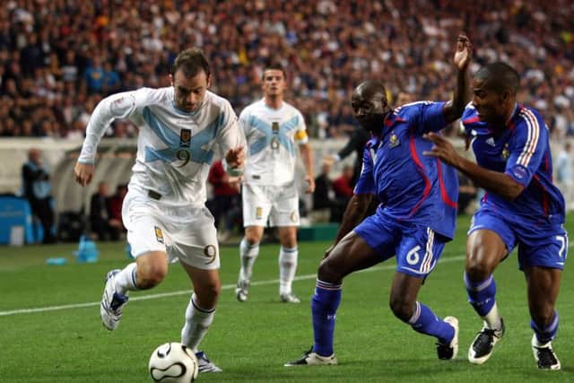 James McFadden takes on Claude Makelele at the Parc des Princes in September 2007. Picture: PA