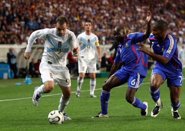 James McFadden takes on Claude Makelele at the Parc des Princes in September 2007. Picture: PA