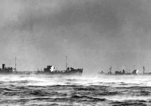 Ships passing through Arctic fog while on convoy duty in the Northern Waters