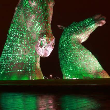 The Kelpies turn green. Picture: Stewart Attwood